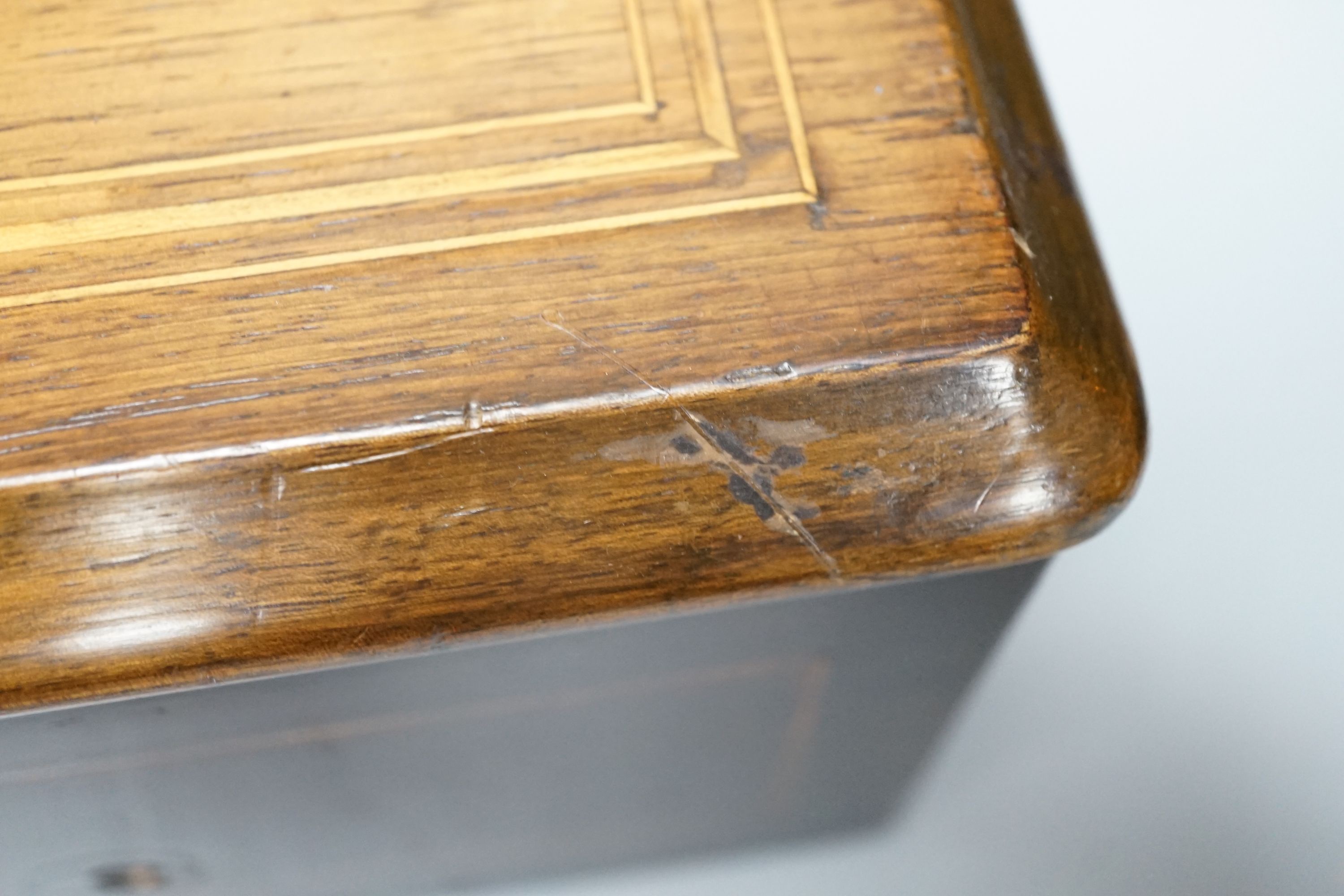 A 19th Century Swiss cylinder music box, in inlaid case, 15 x 43cm